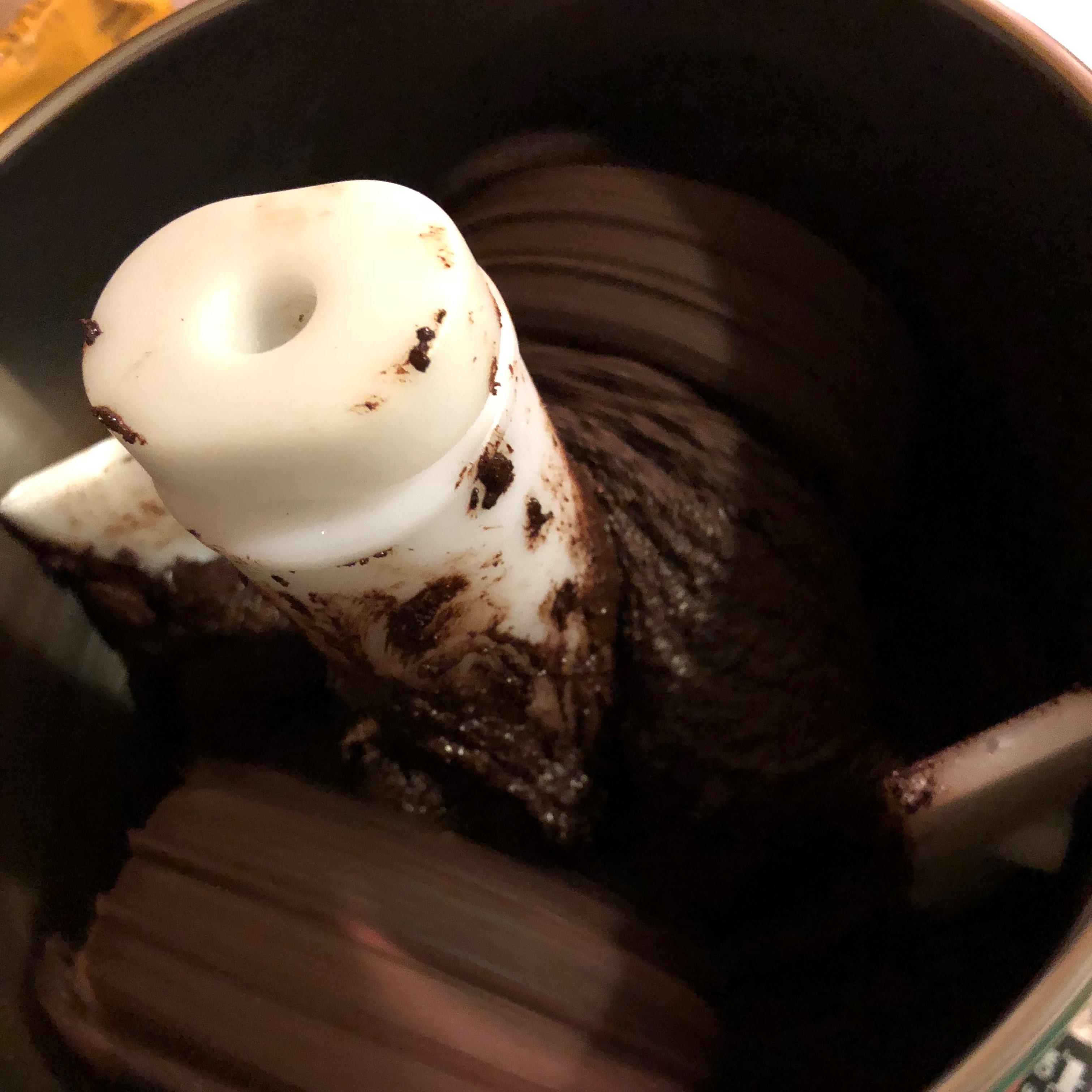 chocolate being ground in a grinder